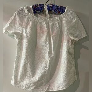 White eyelet top with built in white tank.